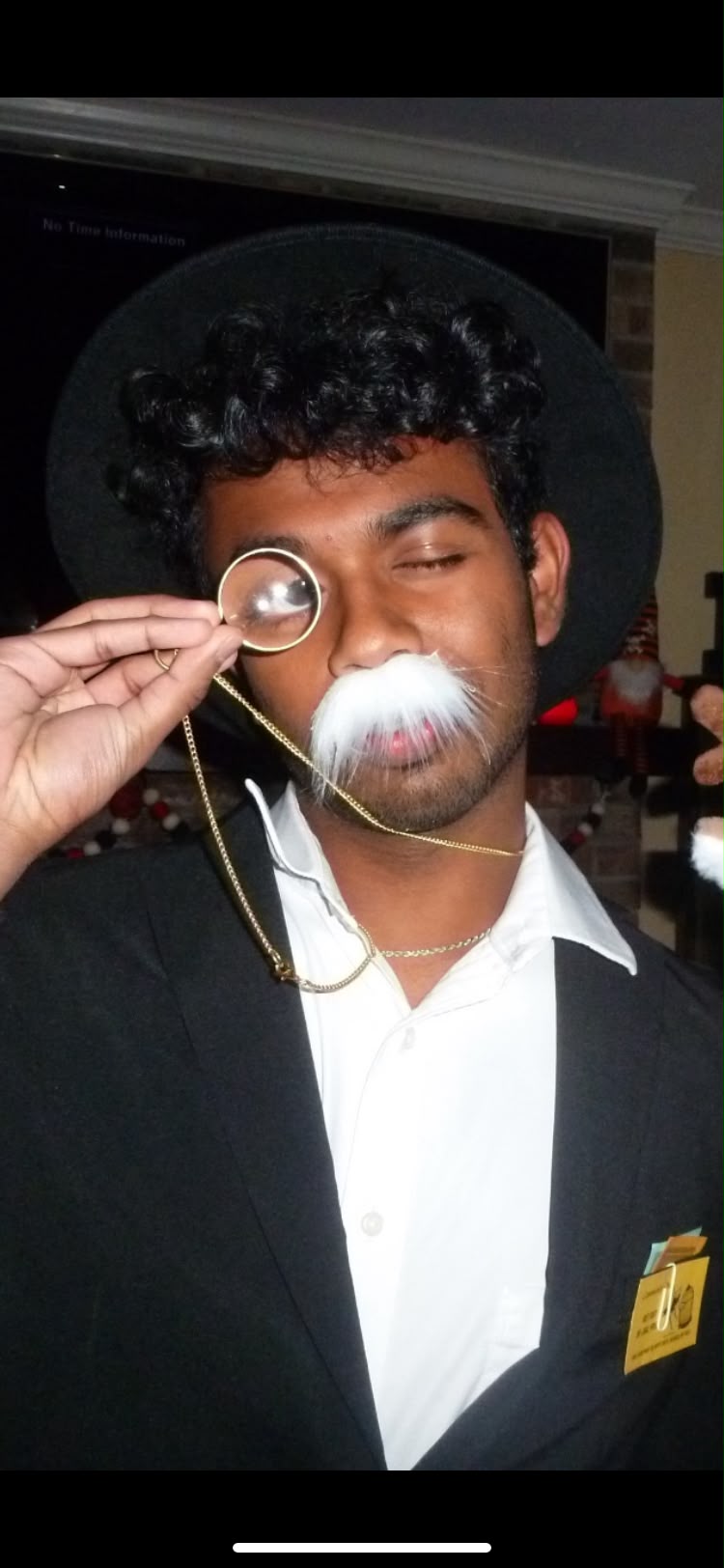 Satya Kokonda dressed as Mr. Monopoly, holding a monocle